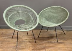 A pair of mid-century cane and wicker chairs, mint-green woven seats raised on tubular steel