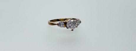 A 9ct gold ring set a facet cut cz approximately 0.75ct flanked by a heart facet cut cz to each