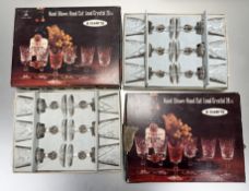 A collection of boxed Crystal Brand glassware comprising, two boxed sets of six clarets glasses (h-