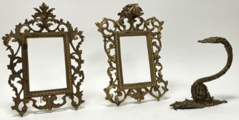 A near-matched pair of gilt metal frames in the Rococo style, with scroll and leaf detail and beaded