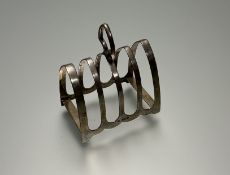 A Sheffield Silver four division toast rack with loop handle, 1933, Robert Stewart Ltd (w. 10cm x h.