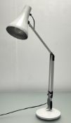 A white Anglepoise lamp of typical hinged and rotating form on a weighted base (h. 79cm), plug
