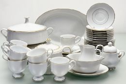 A Noritake Goldlane pattern part dinner service comprising, a gravy boat, two lidded tureens, a