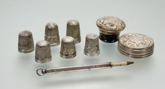 A collection of four hallmarked silver and two sterling silver thimbles, two silver hallmarked