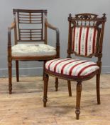 A William IV mahogany armchair, carved floral motif to back over horizontal splats, reeded arms