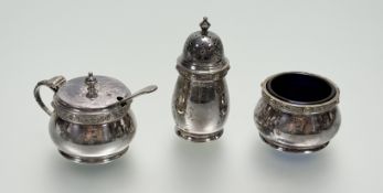 A epns three piece condiament set with celtic border to include a cauldron salt with blue glass