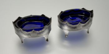 A pair of late Victorain London silver adam style navette shaped pierced salt sellers with