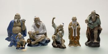A collecton of Shiwan lead-glaze figures comprising, a mudman fisherman with raised fist figure (