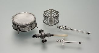 An Edwardian Birmingham silver circular ring box higed top and original pink satin and velvet-