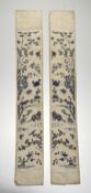 A pair of Chinese textile stich work sleeve bands on silk, depicting garden settings with