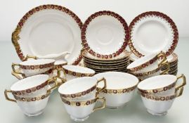 A Royal Crown Derby Heraldic Maroon pattern part service comprising, two serving dishes (l-24cm),