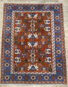A modern hand-knotted Turkish Kazak carpet, central panel with geometric floral motifs enclosed