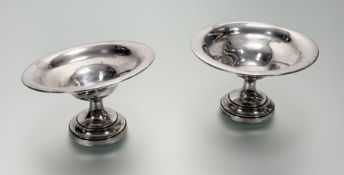 A pair of Birmingham silver tazza style nut dishes on circular weighted bases with engraved