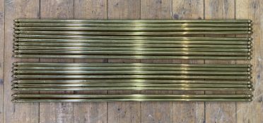 A set of nineteen antique brass stair rods: L. 81cm
