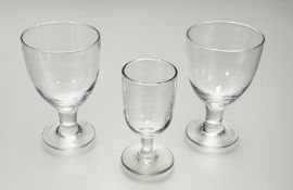 A near pair of late Georgian Rummer glasses (h-16cm chip to one rim) and wine glass (h-14cm). (3)
