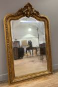 A French Napoleon III-style giltwood mirror, shell crest to arched top with moulded frame