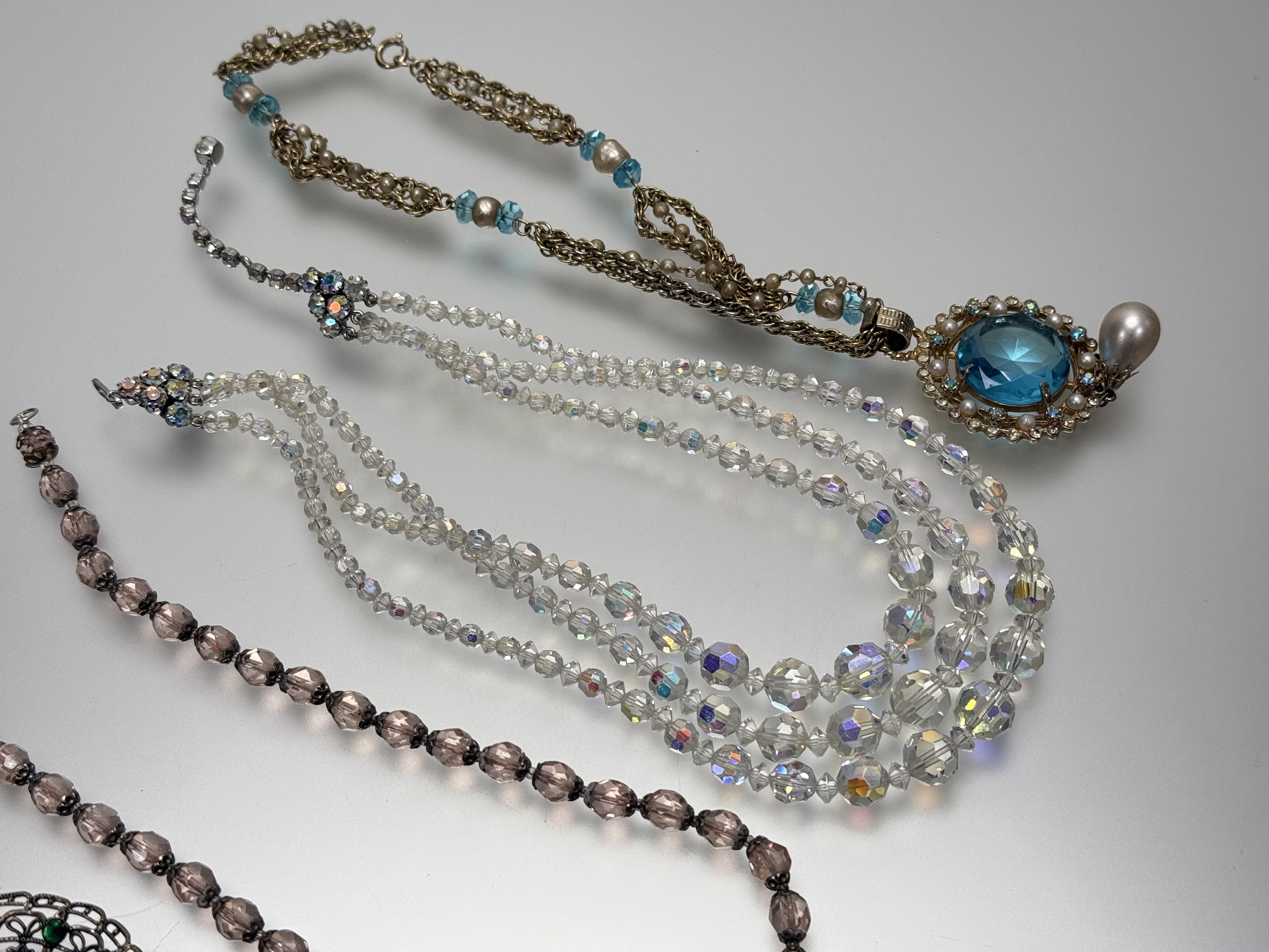 An Austrian iredescent three stand graduated faceted crystal bead necklace: l. x 20cm together - Image 2 of 4