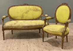 A French Louis XV-style giltwood sofa and armchair, carved giltwood frame with floral motifs and