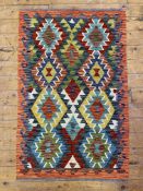 A hand-knotted Chobi kilim rug, central panel with two rows of geometric motifs on navy ground and