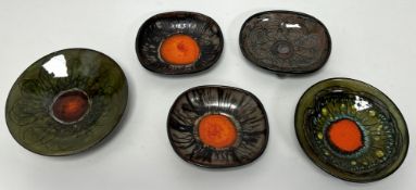 A collection of Chelsea Pottery, comprising a Mid-Century footed bowl featuring a central bright red