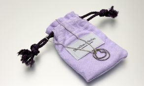 A Hamilton & Inches Edinburgh silver hammered circular and heart necklace with hammered finish on