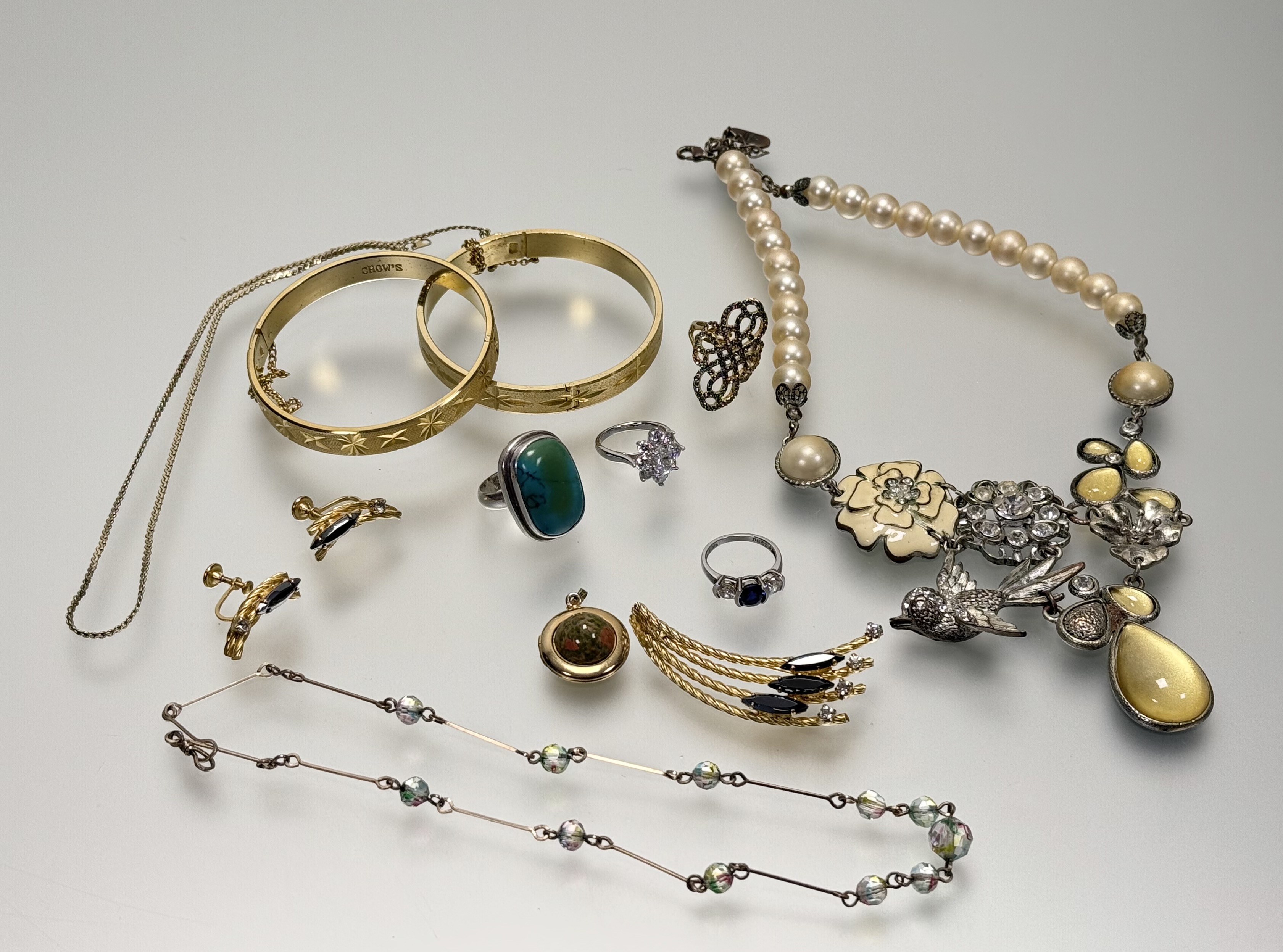 A collection of costume jewllery to include a silver CZ set cluster ring L/M 4.7g, a silver three