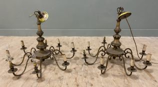 A pair of modern patinated brass chandeliers, each with eight branches and central baluster-style