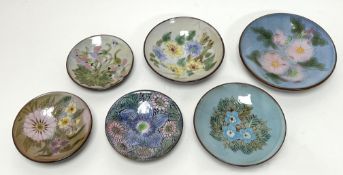 A collection of six Chelsea Pottery footed dishes of varying sizes, each with polychrome