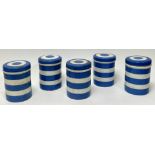 A collection of blue and white T.G. Green Cornishware kitchen storage jars with covers, each with