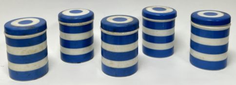 A collection of blue and white T.G. Green Cornishware kitchen storage jars with covers, each with