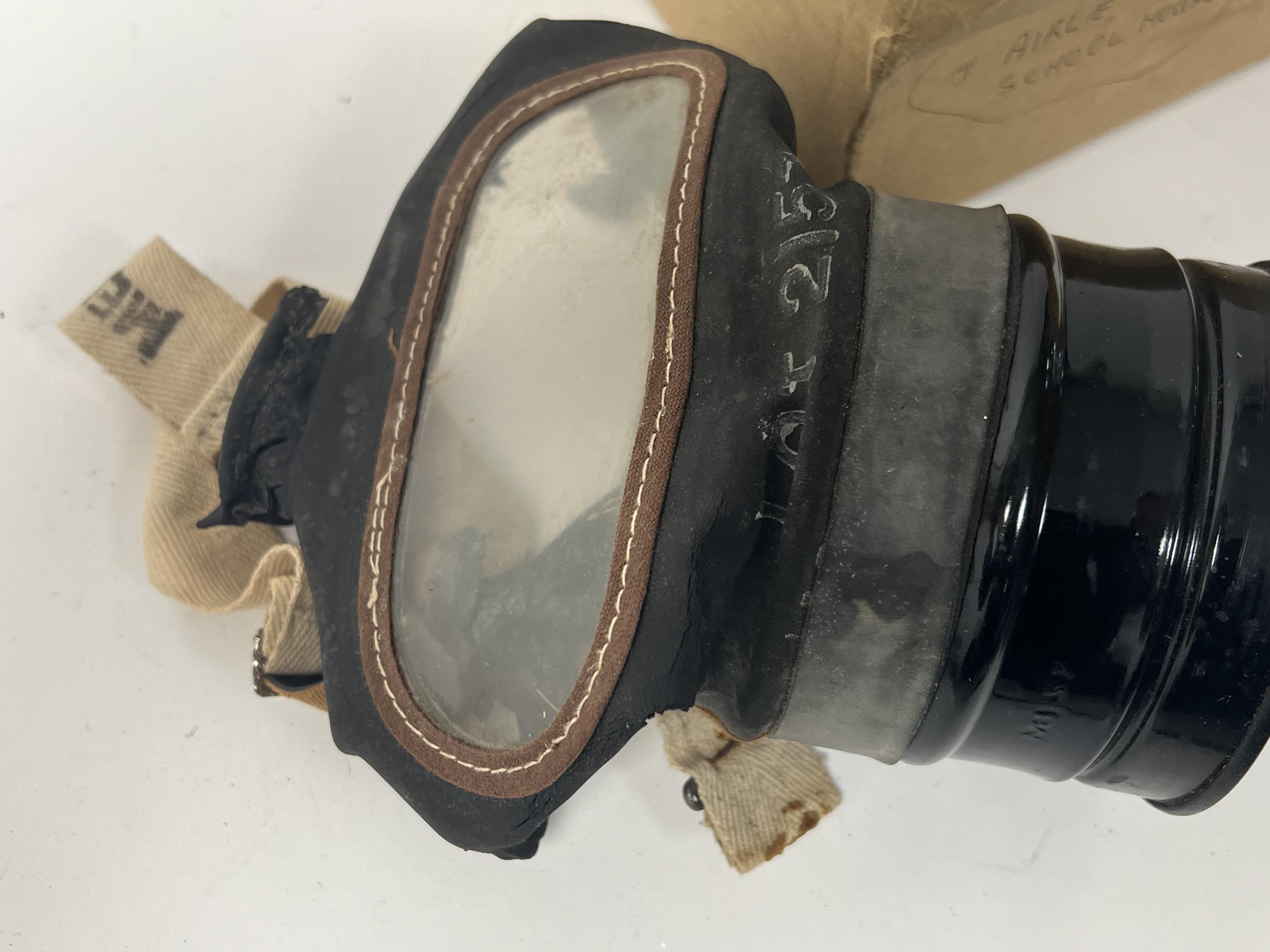 A WWII gas mask, bearing 'Lot 2157' to front, medium printed to side strap, issued by Glasgow A.R.P. - Image 3 of 5
