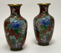 A pair of 20thc Chinese red cloisonne vases of shouldered form, decorated with chrysanthemums and