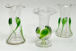 A pair of early 20thc glass vases of flared form with shaped tops and applied green trails (h. 13.