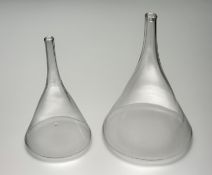 A graduated pair of glass wine funnels, chips to base funnel. (tallest h-23cm smallest h-20.5cm) (