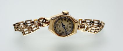 A vintage 9ct gold Bernex wristwatch with champagne dial and arabic numerals on rolled gold