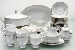 A Noritake Goldlane pattern part dinner service comprising, a gravy boat, two lidded tureens, a