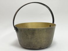 A Victorian brass jam/jelly pan with loop handle (h. 31cm)