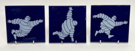 A collection of three Bibendum 'Michelin Man' tiles, made in Spain by Azulindus c1970, white