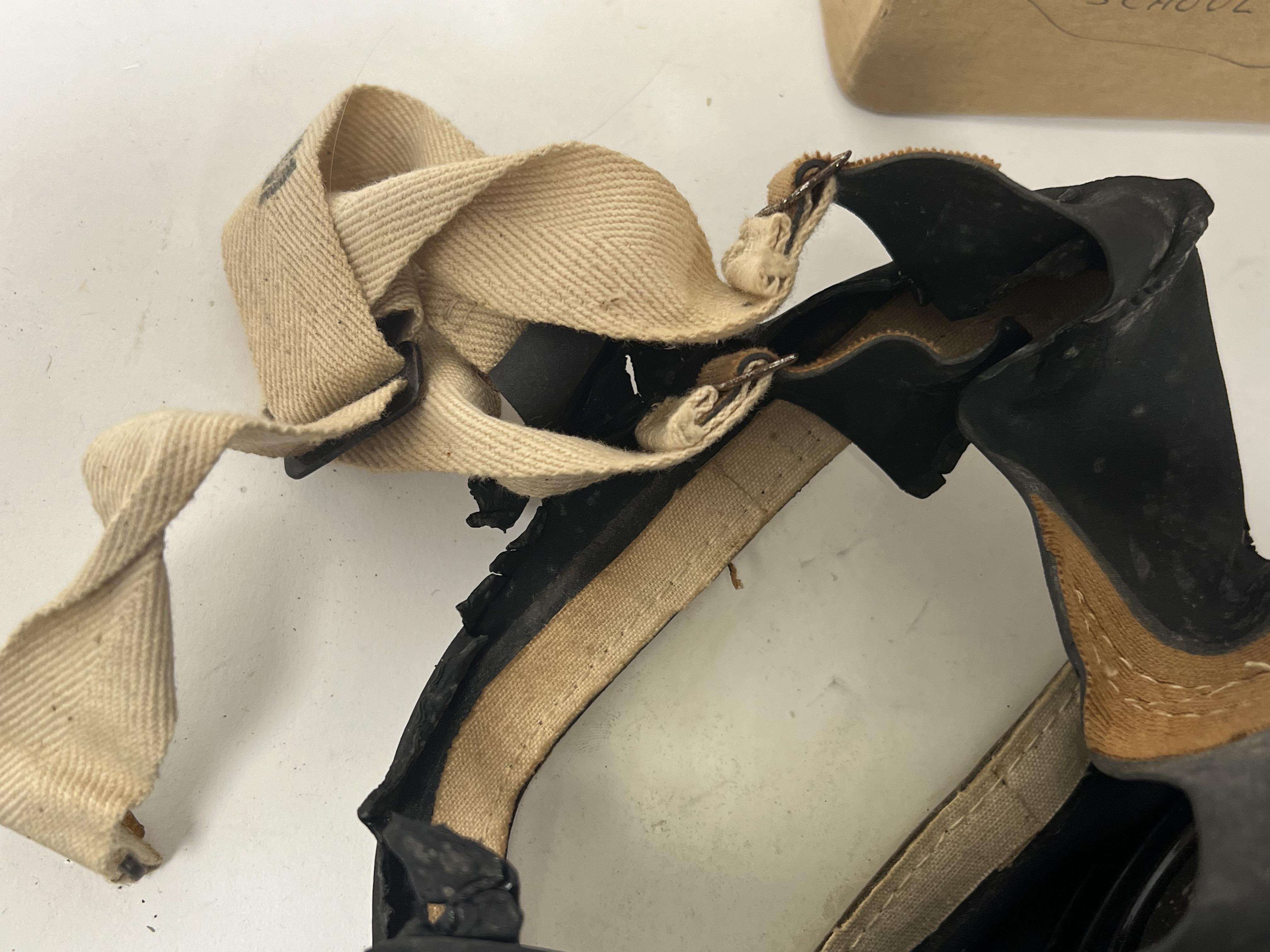 A WWII gas mask, bearing 'Lot 2157' to front, medium printed to side strap, issued by Glasgow A.R.P. - Image 4 of 5