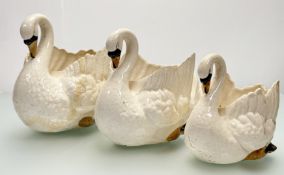 A 1960's graduated trio of ceramic hand-painted swan pots / planters, repairs/ cracks to all a/f. (