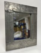 A 20thc pewter- framed wall mirror in the Art Nouveau taste, the frame with embossed stylized linear