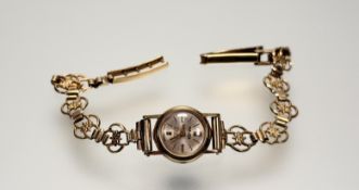 A vintage Majex wristwatch with silvered dial and baton hour markers on 9ct gold bracelet: d. x 0.