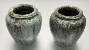 A near pair of studio pottery pots in a mottled green and brown glaze (h-21cm) (2)