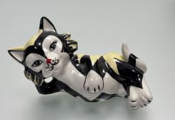 A Lorna Bailey (English Potter 1948-) pottery figurine of a cat lying down, signed verso. (h-9.5cm