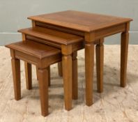 A modern yew and mahogany nest of tables, inlaid rectangular tops raised on tapered square supports: