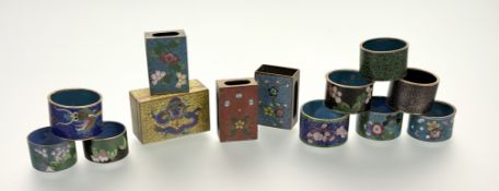 A collection of seven various Chinese cloisonne napkin rings decorated with dragon, flowers and