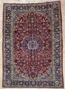 A fine hand-knotted Persian Esfahan carpet, central medallion surrounded by palmettes and stylized