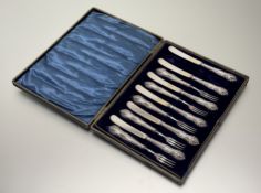 An Edwardian Sheffield silver handled set of twelve fruit knives: l. x 17cm and eleven forks: l. x