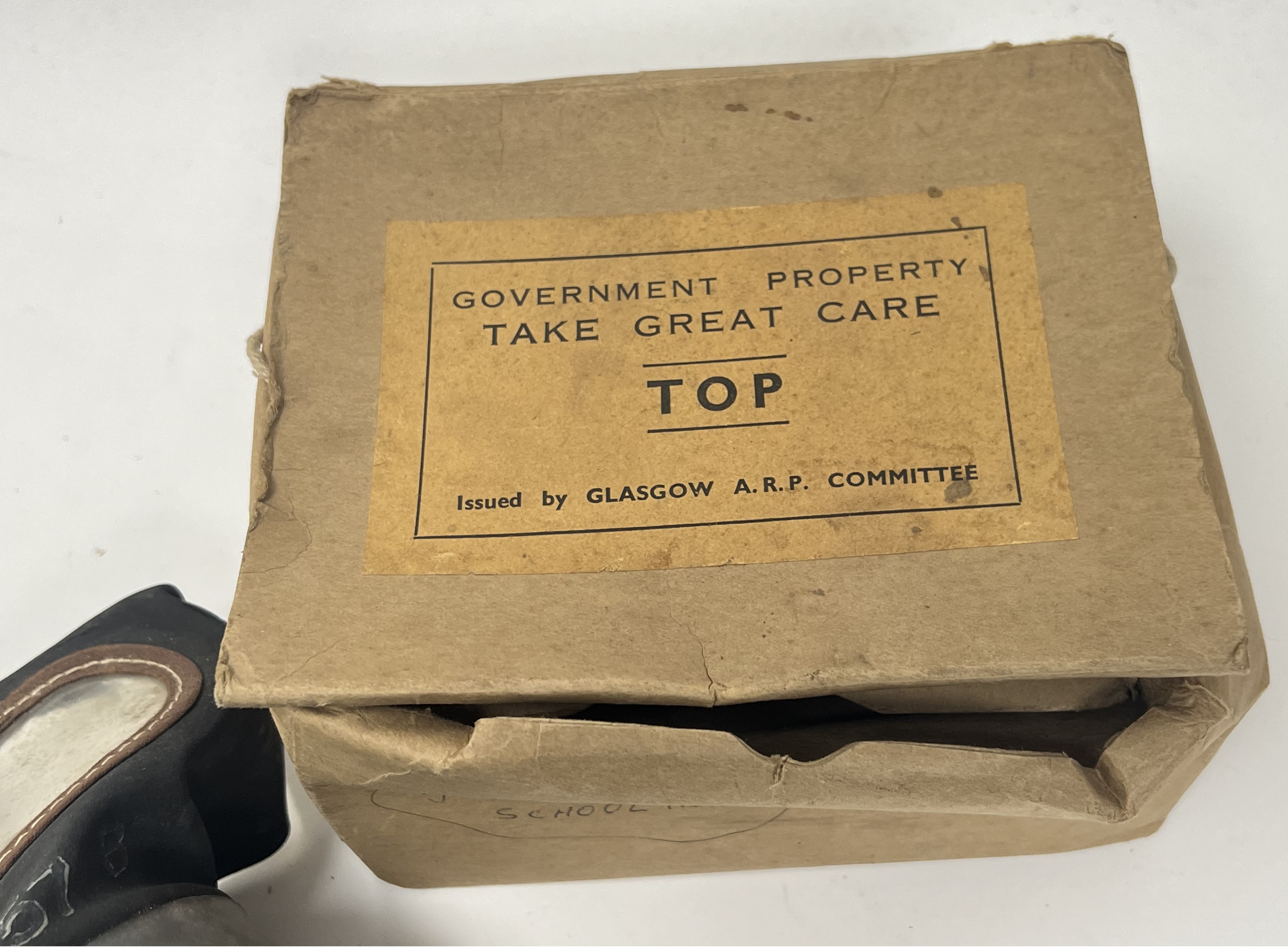 A WWII gas mask, bearing 'Lot 2157' to front, medium printed to side strap, issued by Glasgow A.R.P. - Image 2 of 5