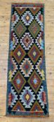A hand-knotted Maimana kilim runner, repeating geometric design on black ground and blue border: